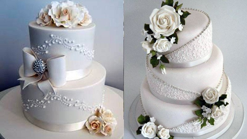 Tortas clásicas en blanco y flores decorativas
